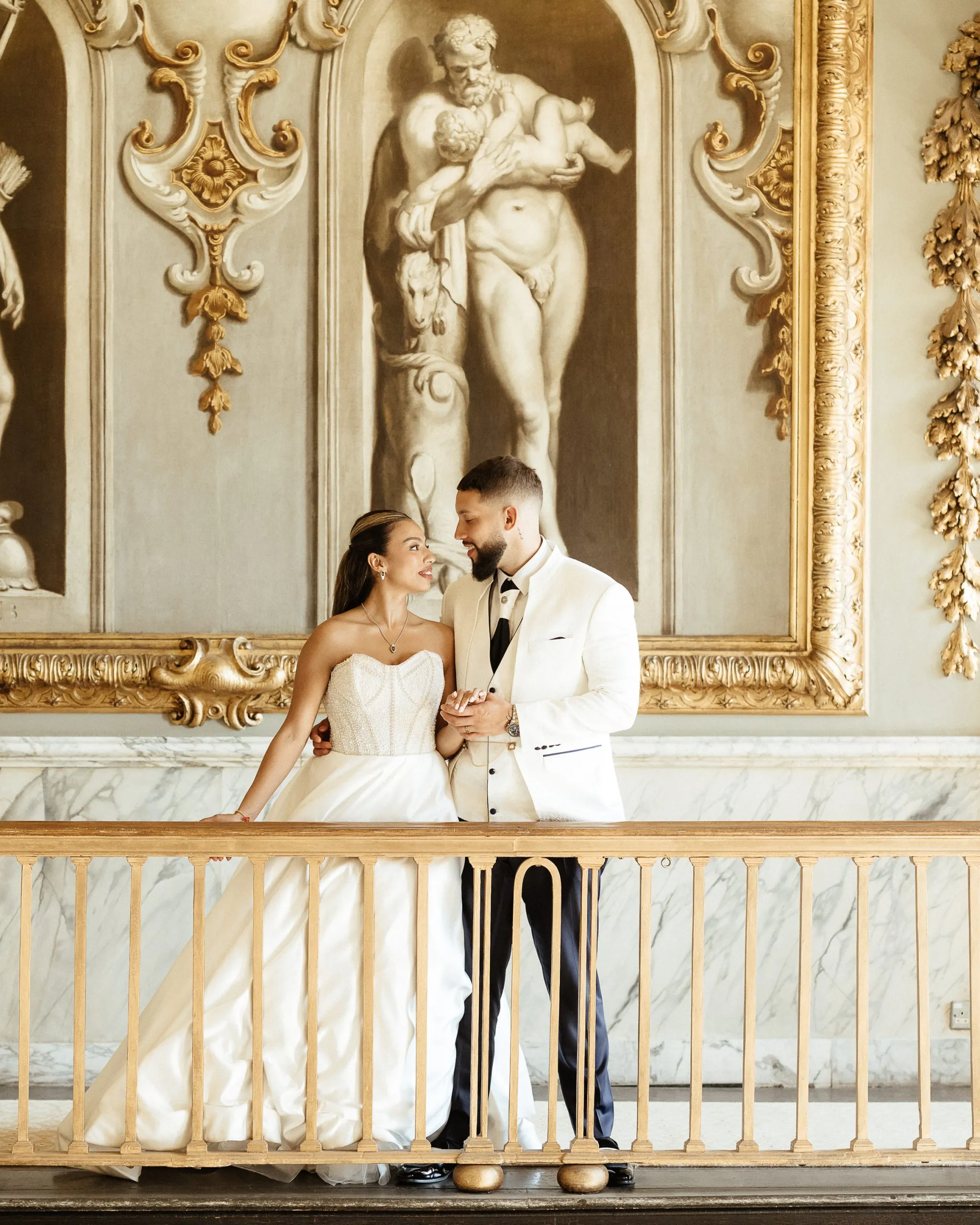 Moor Park Wedding Bride & Groom standing on balcony looking at each other and holding hands inside Moor park wedding venue taken by Shrigley Photography
